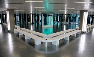 Fashion show venue with white benches