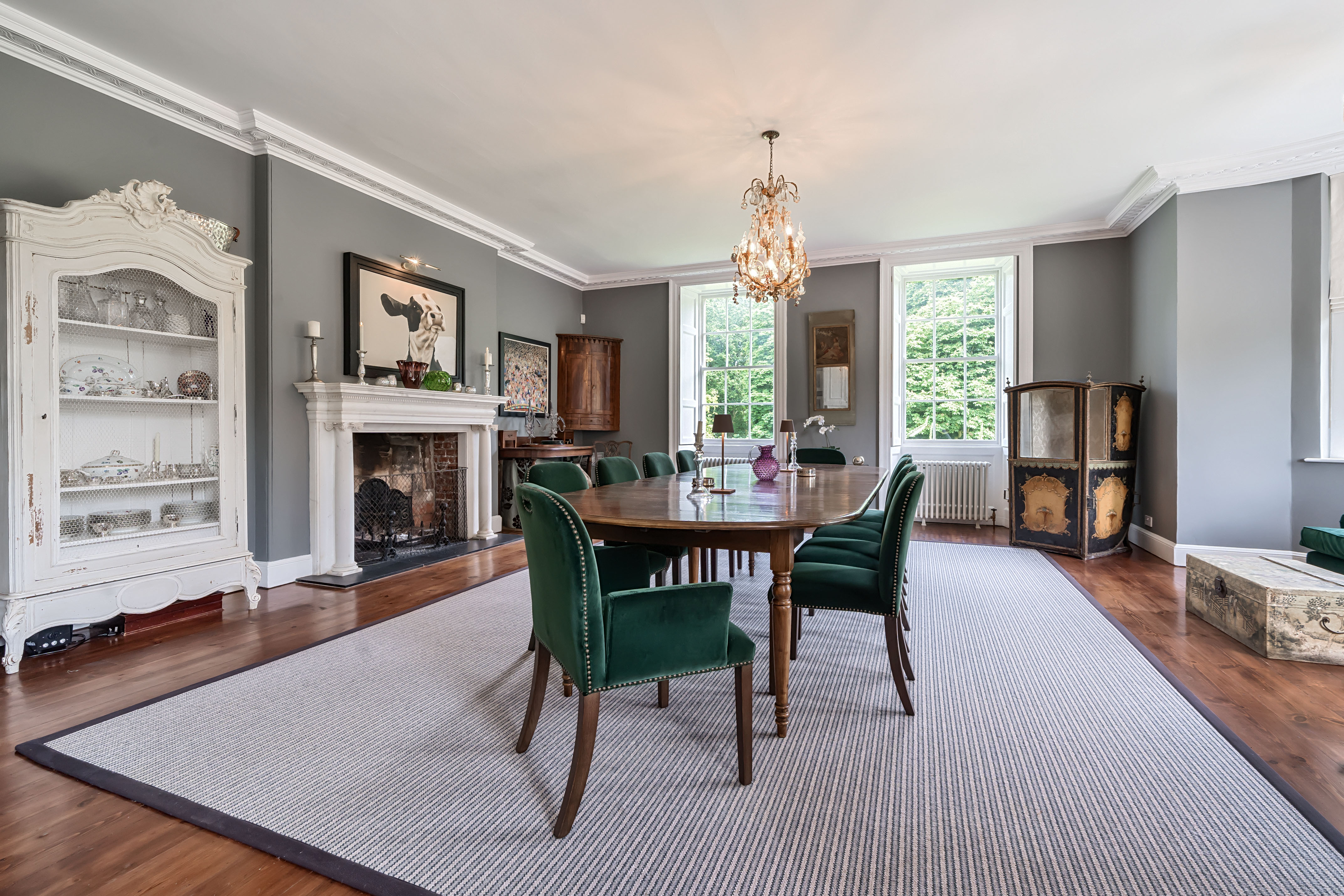 Images of the restored interiors of Polstead Hall, featuring traditional furniture, exposed beams and classical elements