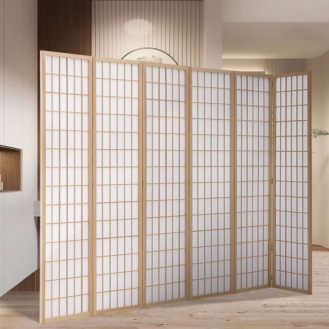 A freestanding folding room divider made of light wood frames with white translucent panels. The screen has multiple hinged sections arranged in a gentle curve. Its grid pattern creates small rectangular panes, allowing soft light through while partially concealing the space behind.