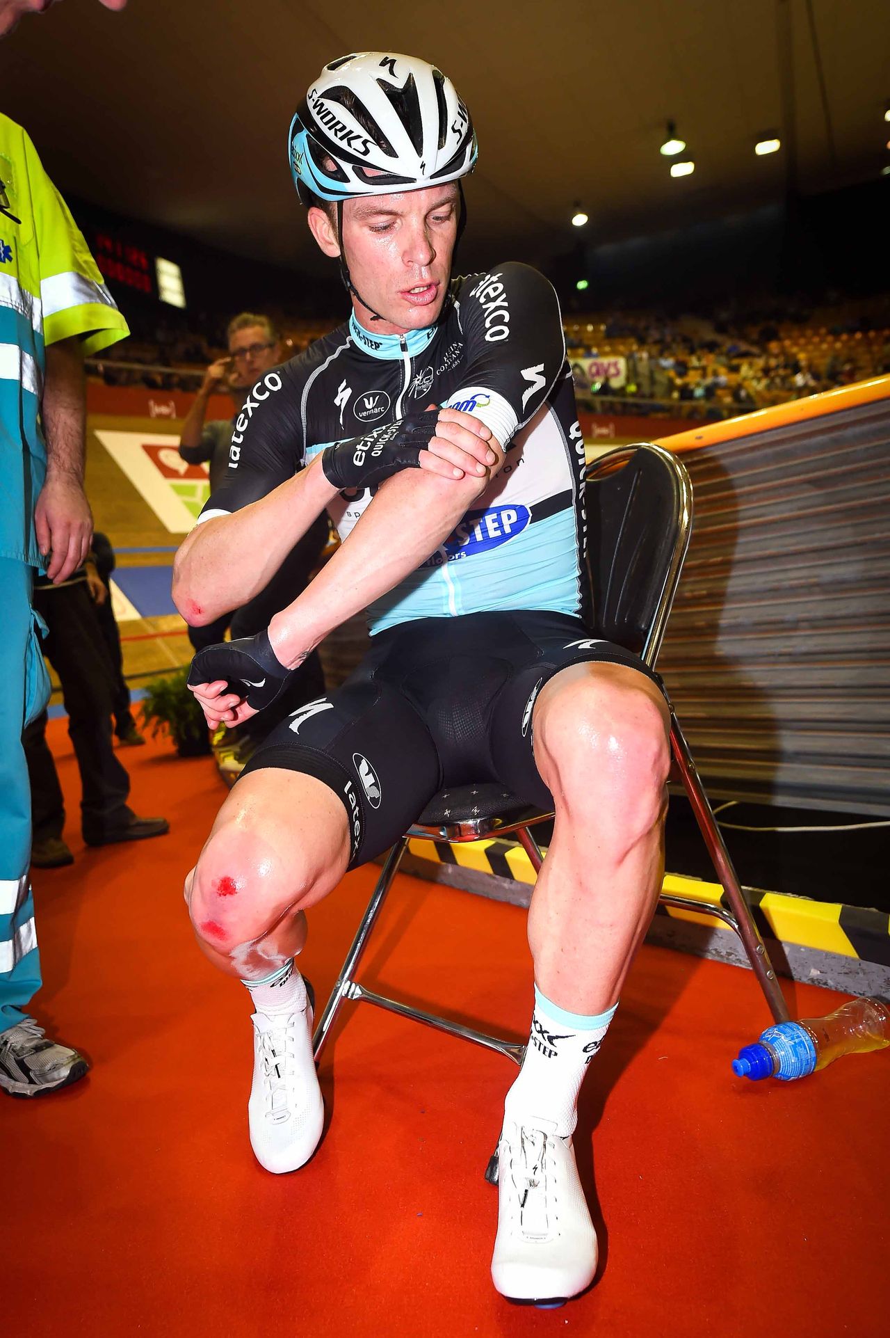 Iljo Keisse checks how much skin he lost in the crash