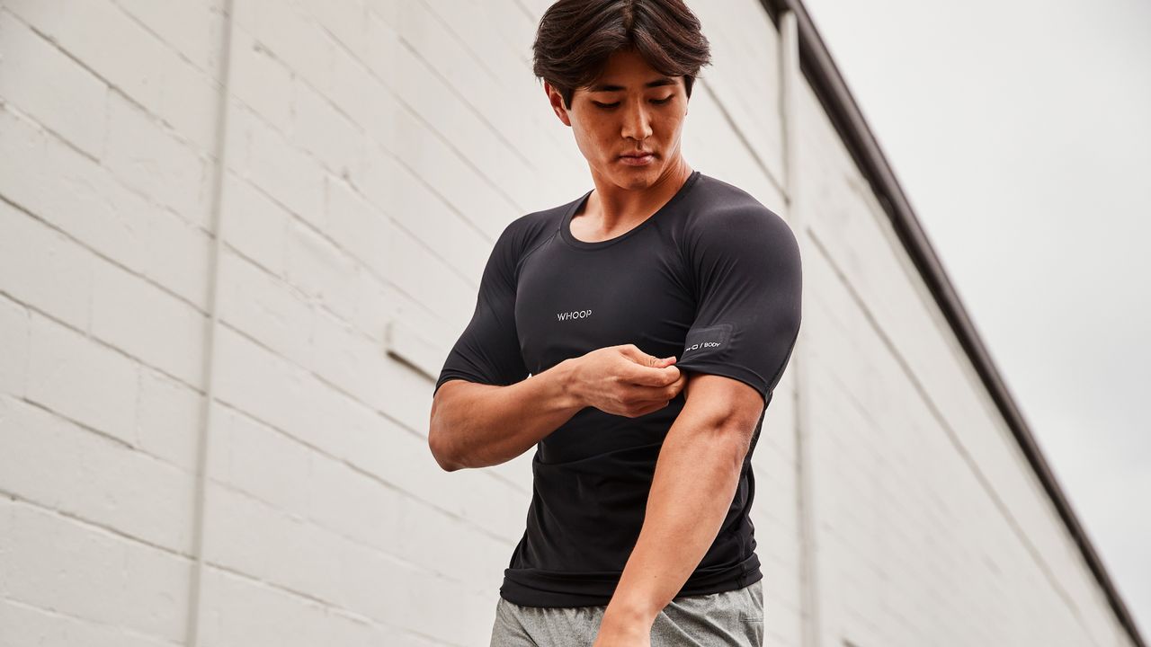 Whoop 4.0 being worn inside a technical t-shirt
