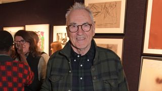 Gavin &amp; Stacey star Larry Lamb wearing a checked shirt and smiling at the camera 