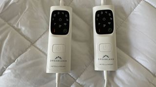 Both remote controls from the Dreamland Snowed In Organic Cotton Electric Blanket