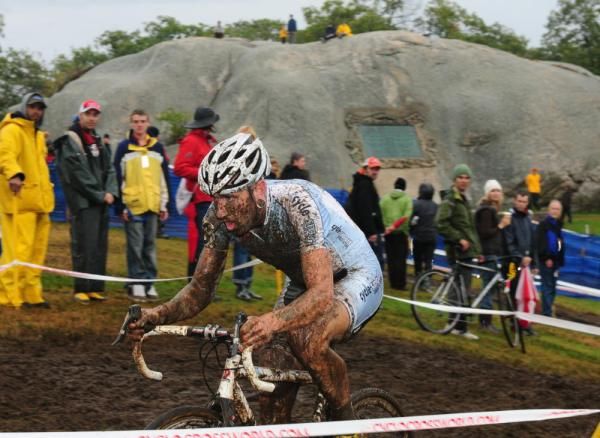 Adam Myerson (Cycle Smart) riding in front of a huge granite rock