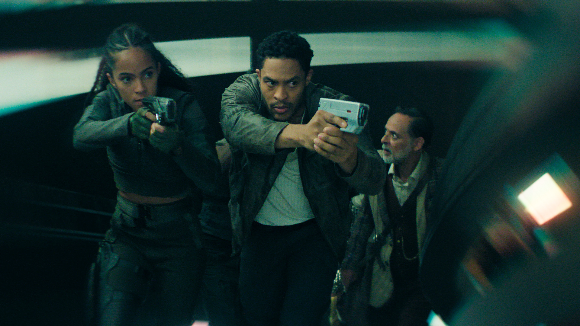 Gaal and Han brandishing handguns in Foundation season 3 episode 10