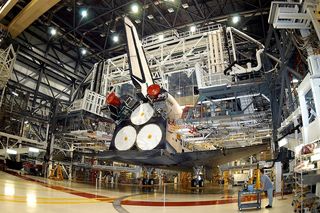 Space Shuttle Atlantis undergoing maintenance at Kennedy Space Center in 2003.