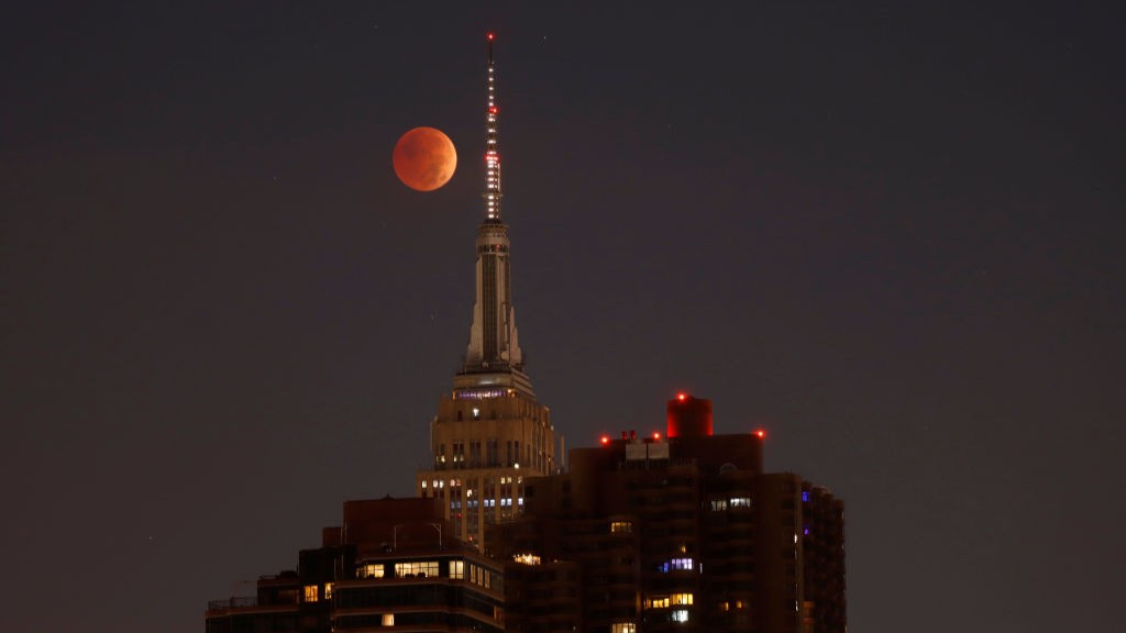  The blood-red full Beaver Moon passes behind the Empire State Building during a total lunar eclipse on November 8, 2022