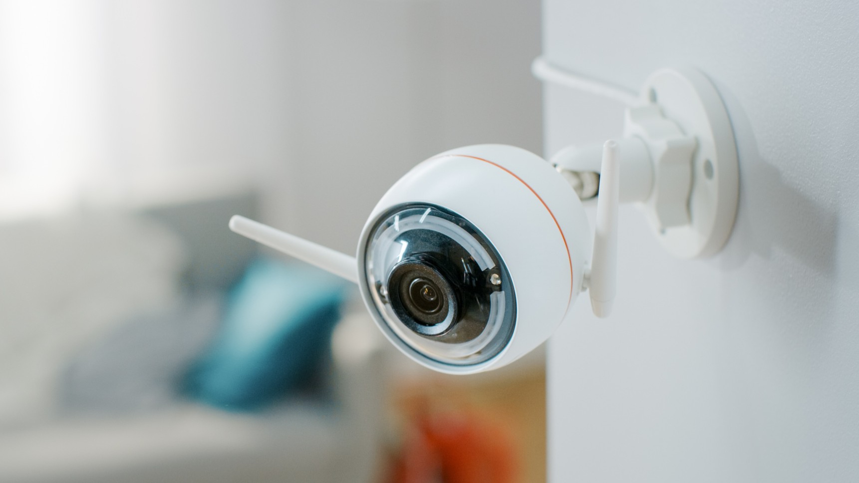 Interior home security camera mounted on wall