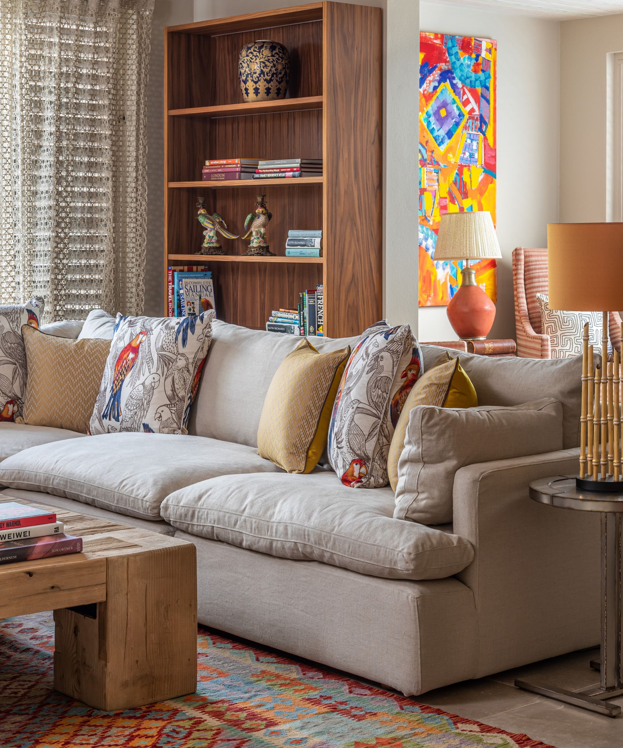 Grey sofa, wooden coffee table and cabinets