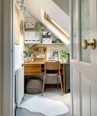 small home office under sloped roof with skylight