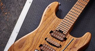 Close up of a Charvel guitar with a compound radius fingerboard