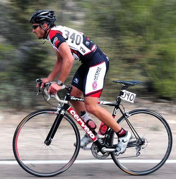 A rider crests the hill on Anklam Rd. outside of Tucson.