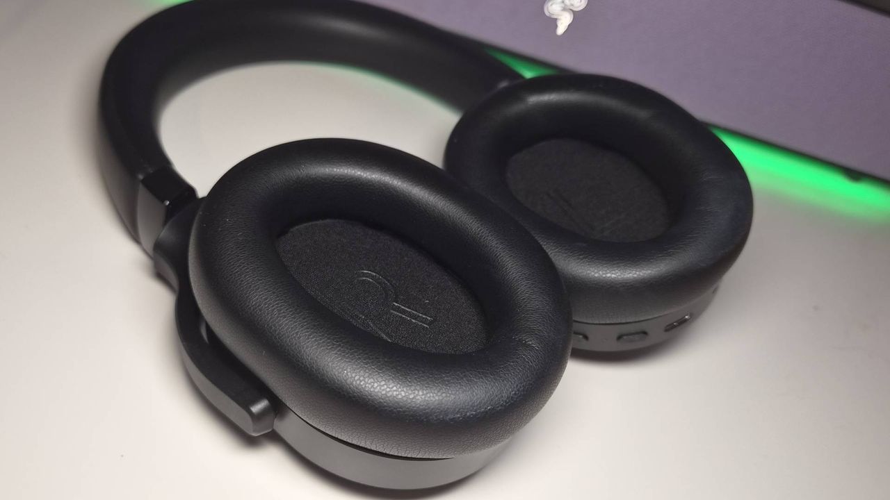 Photo of the Razer Barracuda V2 Pro headset sitting on a white desk.