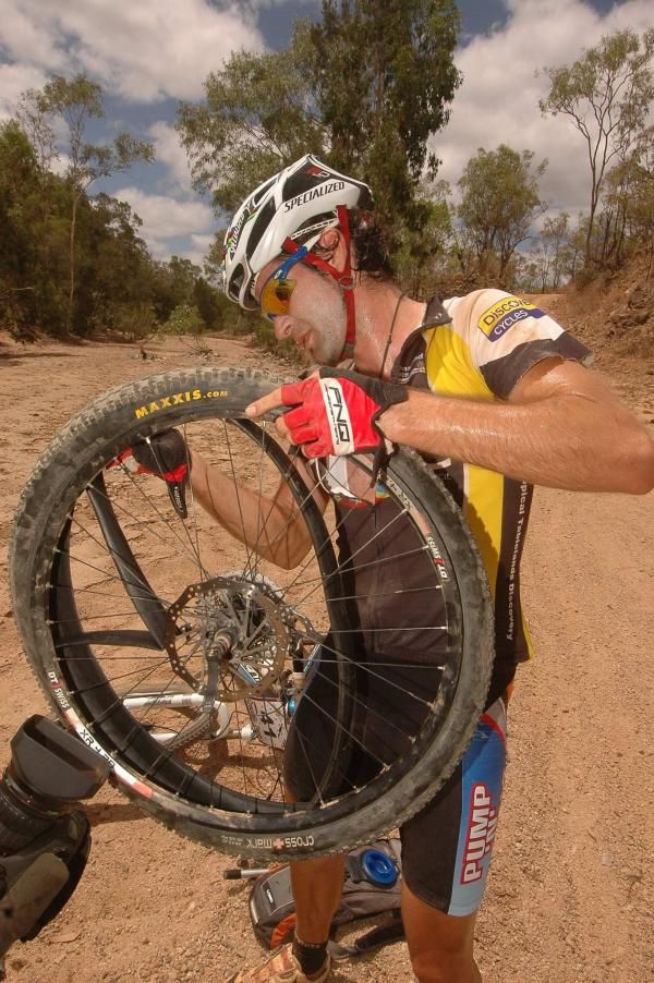 Tropical Tableland Discovery cyclist Isaac Tonello gets to work on another Steve Rankine puncture