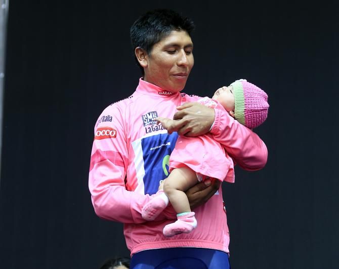 Nairo Quintana with his child on the podium