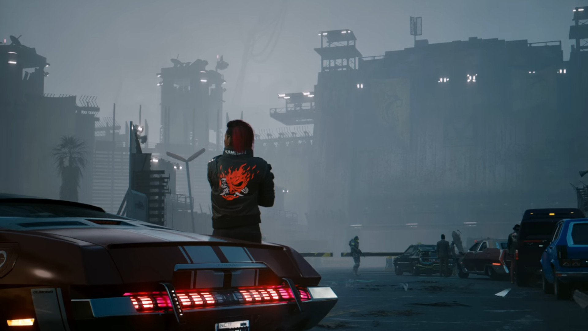 V leaning against a car while looking out at a misty Night City during the RPG, Cyberpunk 2077