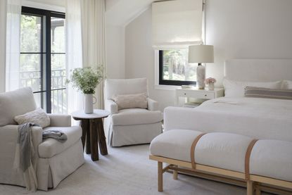 A transitional bedroom in a neutral palette with layers of textiles