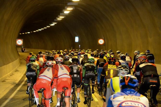 Rider pass through a well lit tunnel
