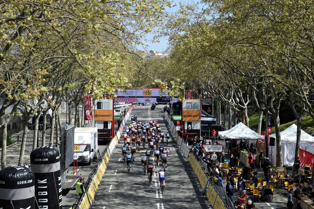 The pack rides during the final stage of the 100th Volta Catalunya 2021 a 133km race starting and finishing in Barcelona on March 28 2021 Photo by Josep LAGO  AFP Photo by JOSEP LAGOAFP via Getty Images