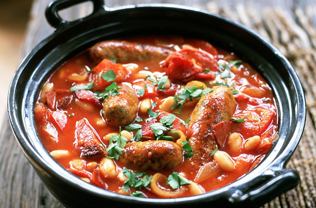 Sausage casserole recipe illustrated with an image of a sausage casserole in a crock pot