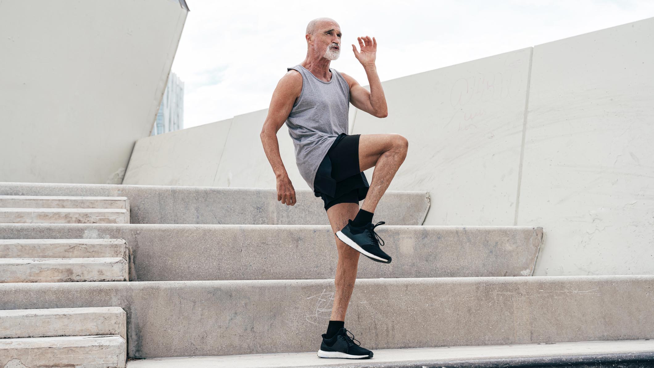 senior man doing step ups