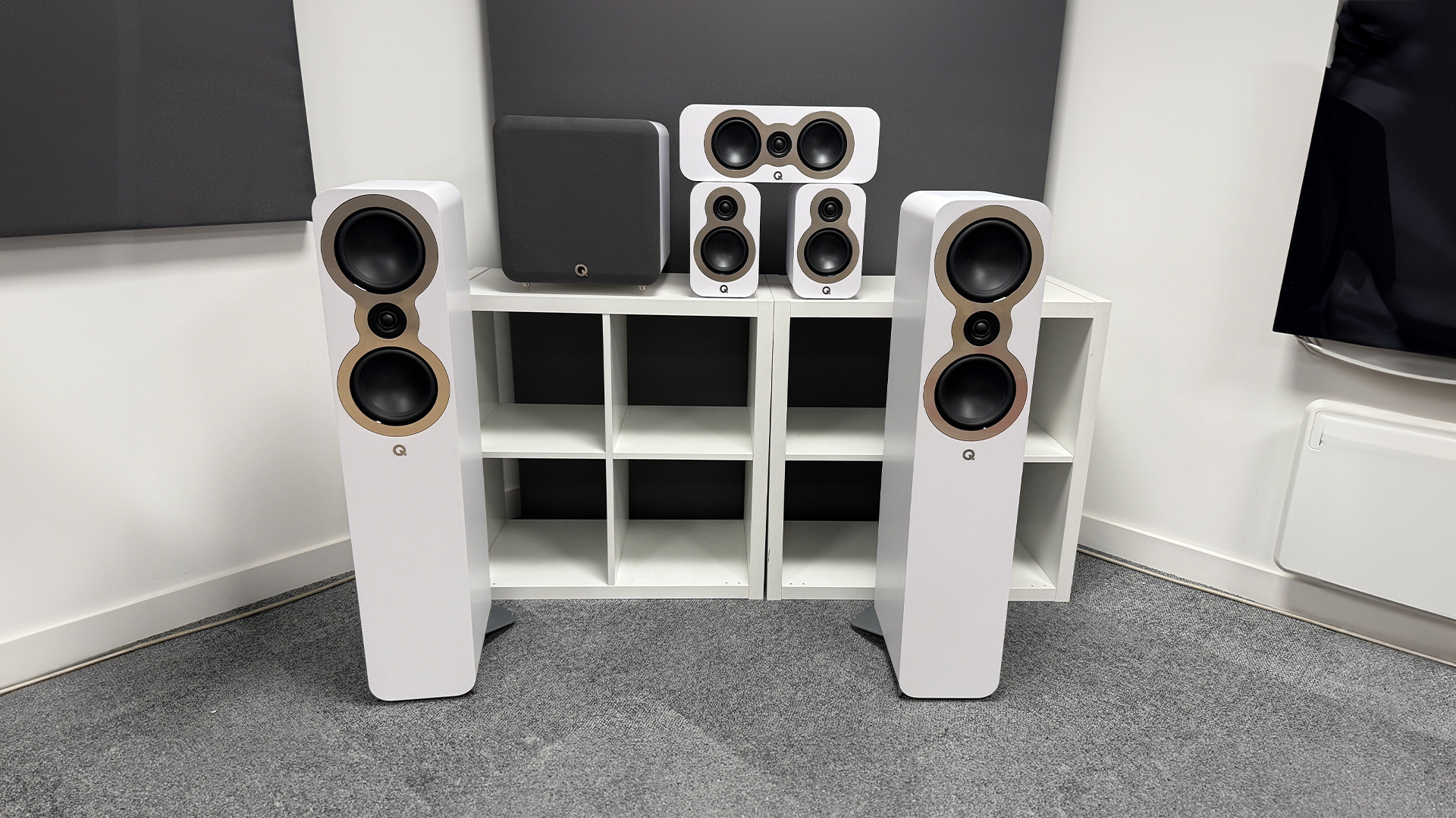 Q Acoustics 3050c 5.1 home cinema speaker package on grey carpet in test room