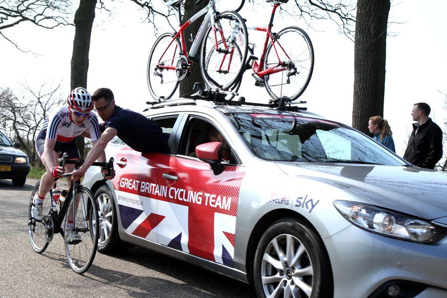 A British rider gets help with a mechanical