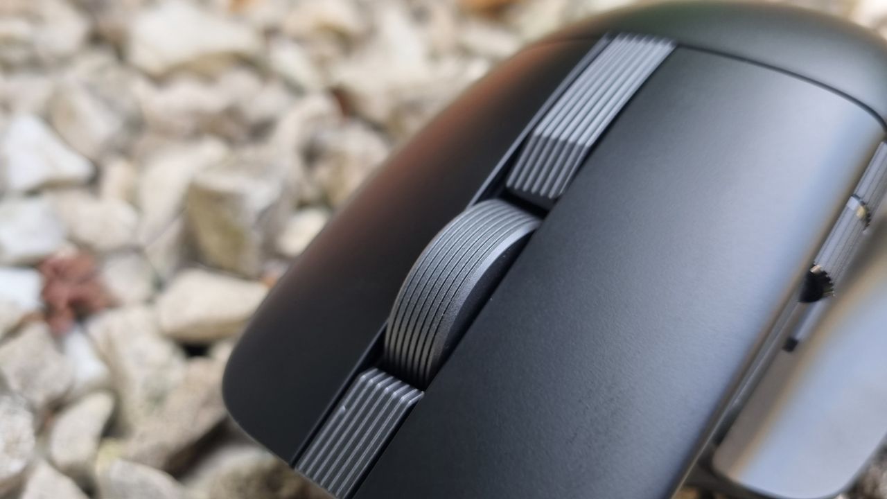 A close-up shot of the Asus ProArt Mouse MD310's scroll wheel