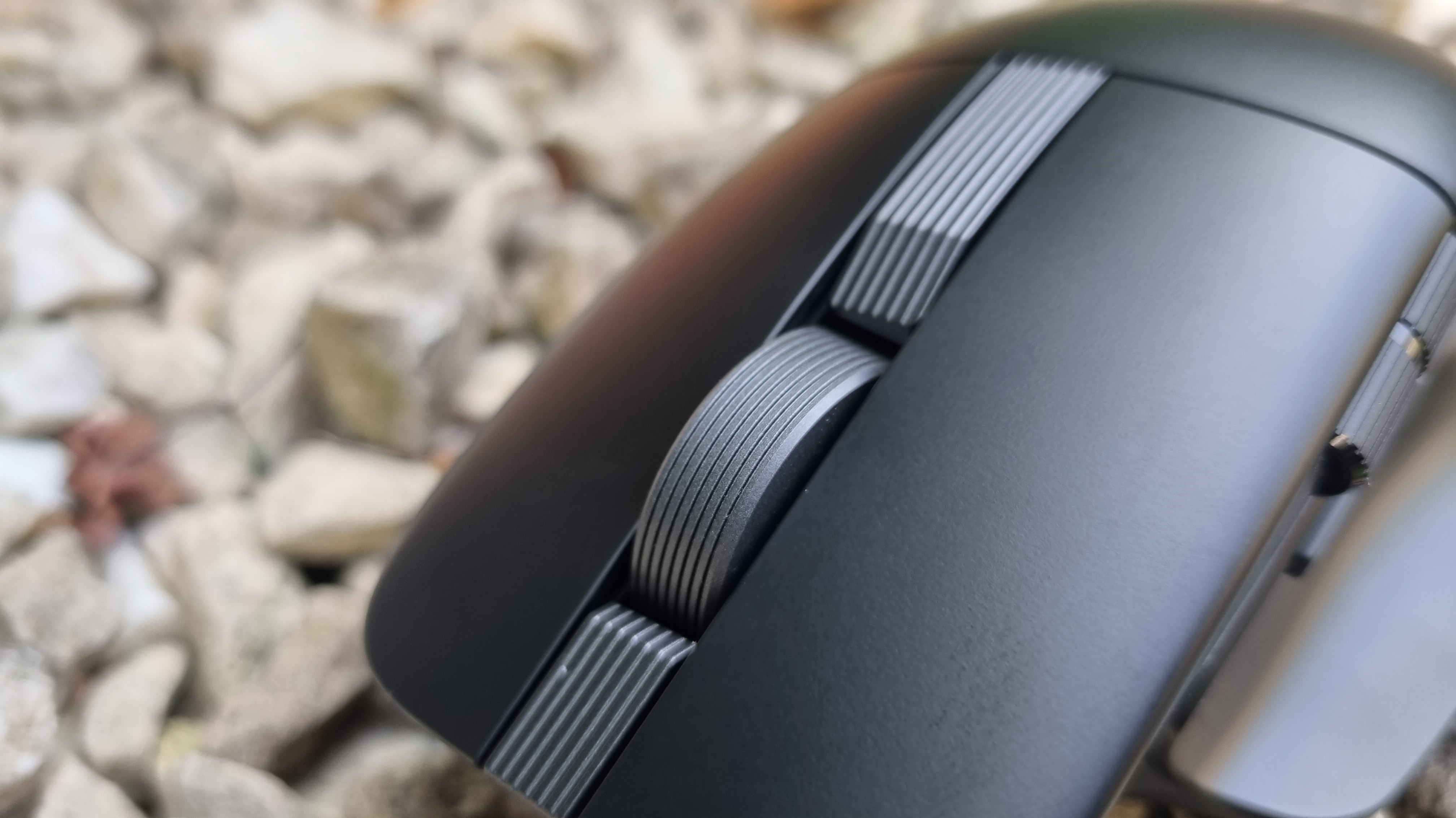 A close-up shot of the Asus ProArt Mouse MD310's scroll wheel