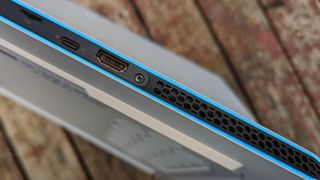 An Alienware X15 R2 gaming laptop on a wooden table