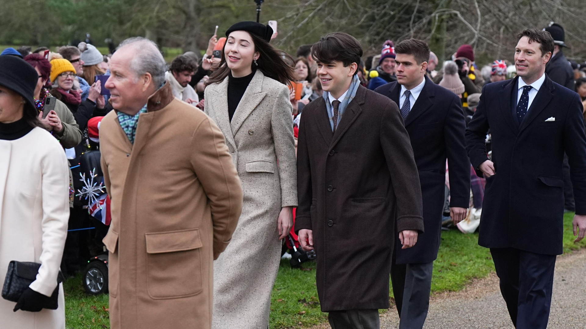 Eleanor Ekserdjian and Samuel Chatto wealking next to each other to church on Christmas Day with Arthur Chatto behind them