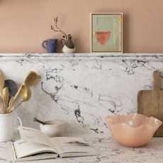 kitchen with peach walls and marble splashback