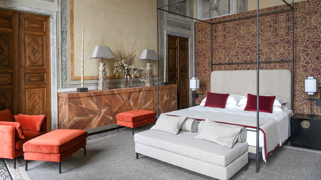 A four-poster bed in a suite at Palazzo Durazzo