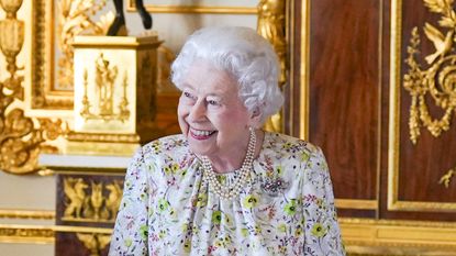 The Queen's throwback photograph has excited fans, seen here after arriving to view a display of artefacts from British craftwork company, Halcyon Days