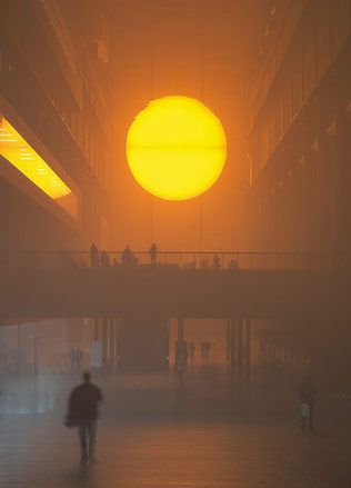 A large sun displayed inside the exhibition space.