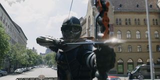 Taskmaster aiming a bow and arrow in Black Widow