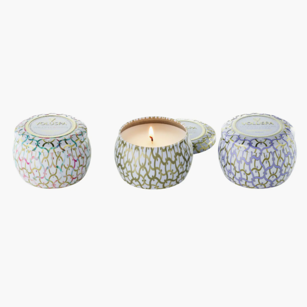 Set of three candles in pretty patterned tins