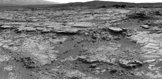The sinuous rock feature in the lower center of this mosaic of images recorded by the NASA Mars rover Curiosity is called "Snake River." Image taken Dec. 20, 2012.