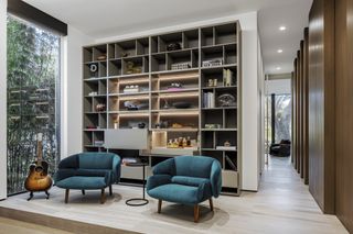 Interior showing living space with library shelving at the Tarpon Bend Residence