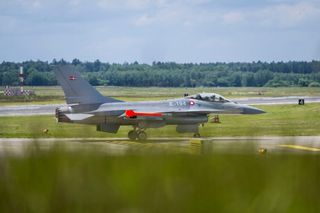 An f-16 Fighting Falcon airplane on hanger at Ramstein Air Base in Germany