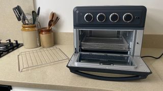 Cuisinart Air Fryer & Toaster Oven open to show how all the parts fit inside