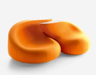 Orange seats with organic shapes by Shinobu Ito