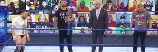 Daniel Bryan, Roman Reigns, Adam Pearce, and Edge on SmackDown