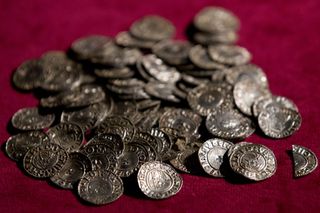 The Lenborough Hoard, unlike that found by Powell and Layton, was correctly handled throughout. These Anglo-Saxon coins, pictured while on display at the British Museum in 2015, were found by Paul Coleman. He and the owner of the land shared a reward based on a £1.35 million valuation of the hoard, which consisted of 5,200 silver pennies and two cut half pennies of kings Æthelred II (978-1016) and Cnut (1016-35). The hoard was discovered in a lead sheet on a metal-detecting rally near the village of Lenborough, Buckinghamshire in 2014.