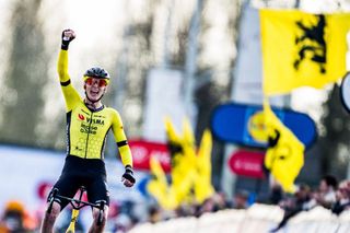 US Matteo Jorgenson of Team Visma-Lease a Bike celebrates as he crosses the finish line to win the men elite 'Dwars Door Vlaanderen' cycling race, 188,6 km from Roeselare to Waregem, on March 27, 2024. (Photo by JASPER JACOBS / Belga / AFP) / Belgium OUT