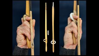 Here we see a hand clenching around the end of a wooden spear, with the forefinger in the "open ring" finger loop.