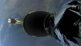 The first stage of a SpaceX Falcon 9 rocket (background) separates from its upper stage during the successful launch of the Sentinel-6 Michael Freilich satellite.
