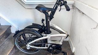 the Volt LITE folding electric bike folded in half