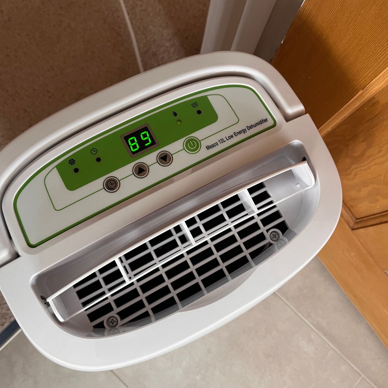 meaco 12l low energy dehumidifier reducing humidity outside bathroom