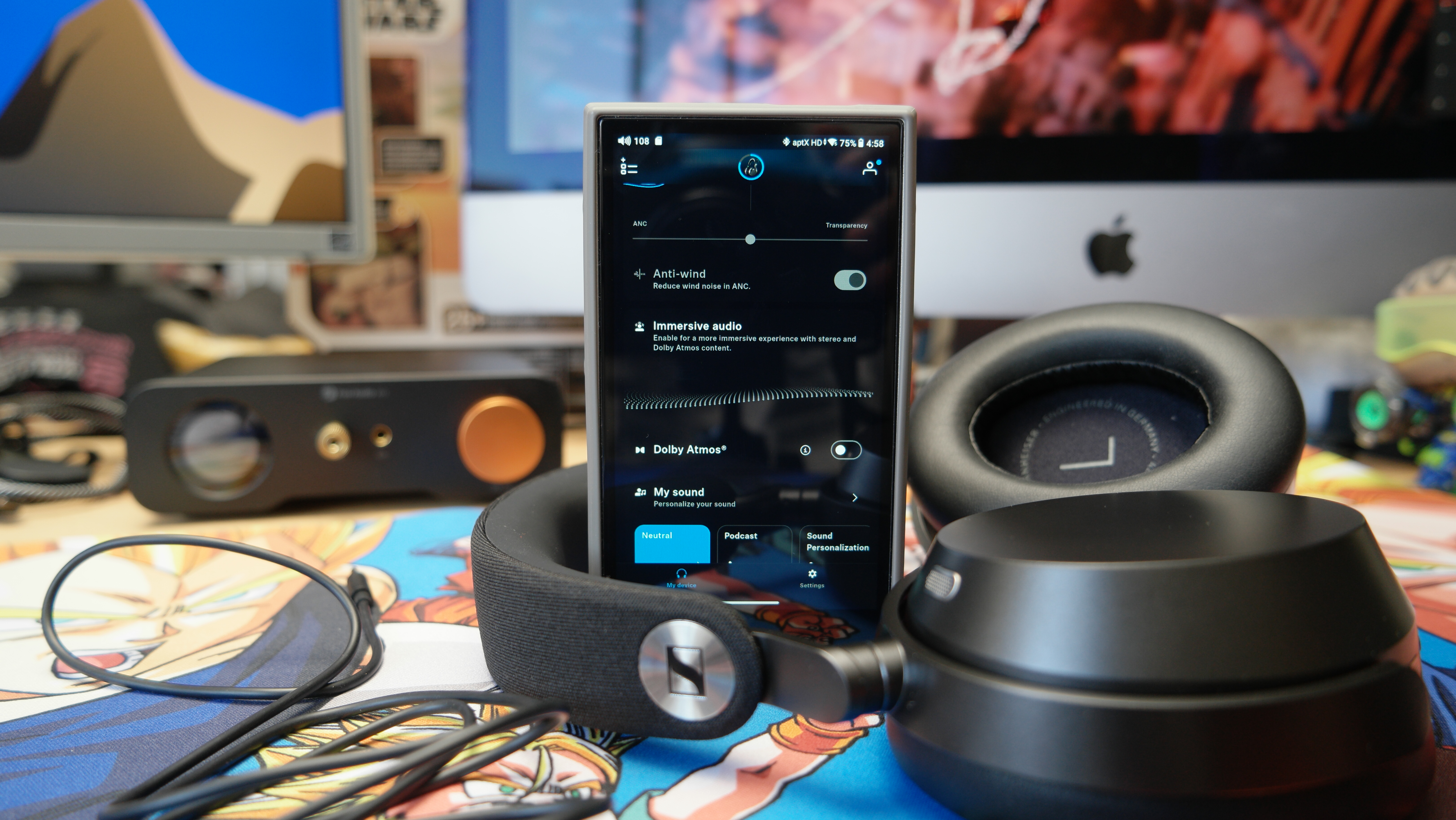 Sennheiser Momentum 5 headphones on a desk with a FiiO M21 DAP